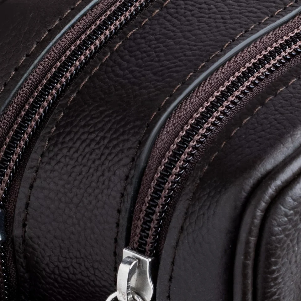 A close view of the leather grain and zip detailing on the Orneli bag